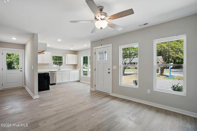 foyer with baseboards, light wood-style floors, a ceiling fan, healthy amount of natural light, and recessed lighting