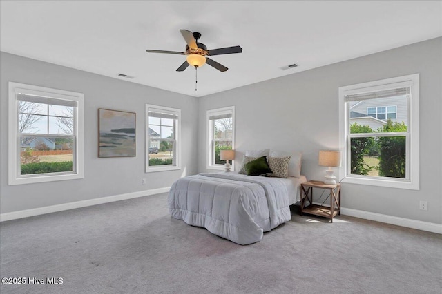 bedroom with visible vents, baseboards, and carpet