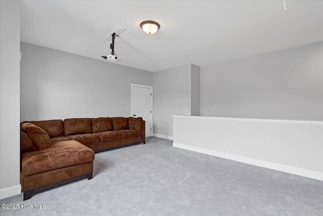 living area with carpet and baseboards