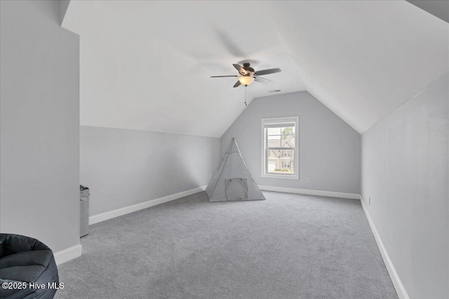 bonus room with baseboards, a ceiling fan, lofted ceiling, and carpet floors
