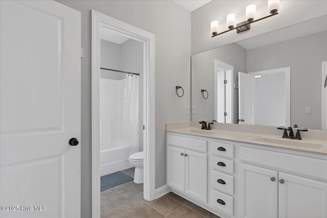 bathroom with a sink, toilet, double vanity, and shower / bath combination with curtain