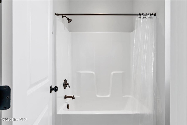 bathroom with shower / bath combination with curtain