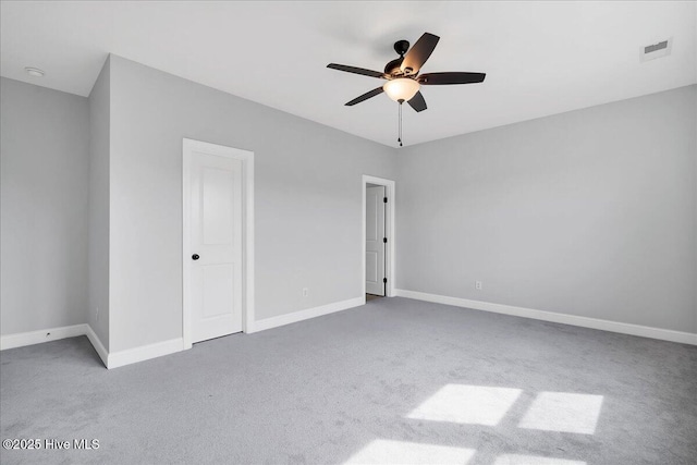 unfurnished bedroom featuring visible vents, baseboards, a ceiling fan, and carpet flooring