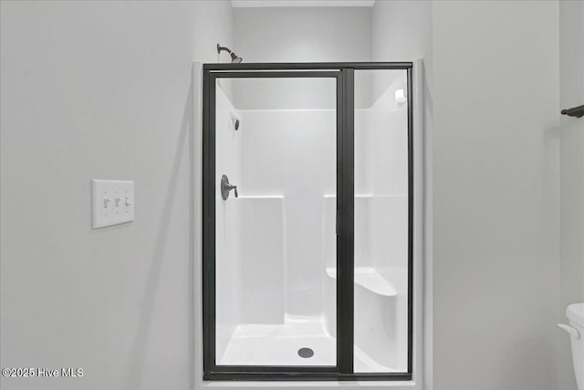 full bathroom with a shower stall