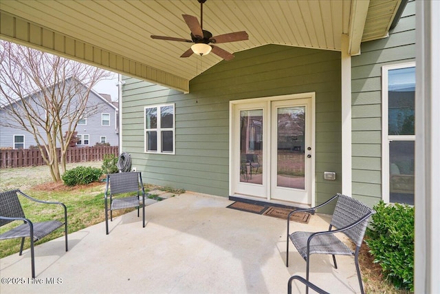 view of patio featuring a ceiling fan and fence