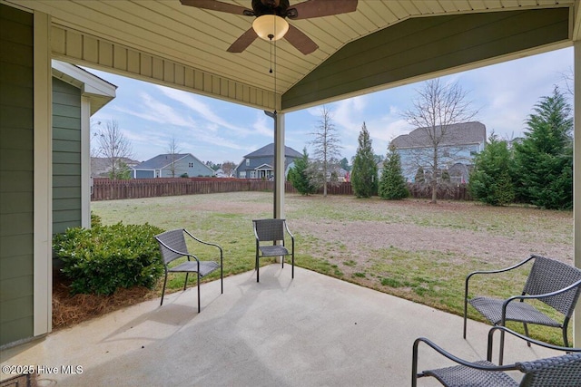 view of patio with a fenced backyard and a ceiling fan