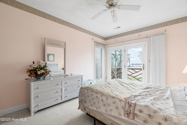 bedroom featuring access to exterior, visible vents, baseboards, carpet flooring, and a ceiling fan