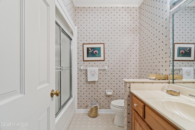 full bath featuring toilet, ornamental molding, tile patterned flooring, bath / shower combo with glass door, and vanity