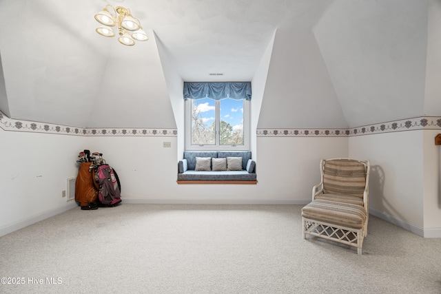 sitting room with visible vents, carpet floors, and lofted ceiling