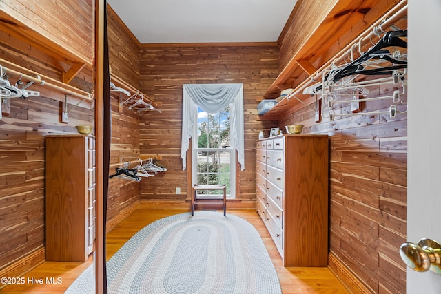 spacious closet featuring light wood-style floors
