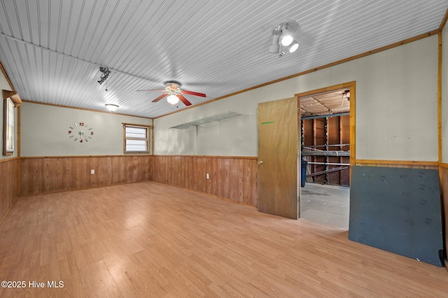 210 E 11th St, Washington, NC 27889 - spare room featuring crown molding, ceiling fan, wainscoting, and wood finished floors
