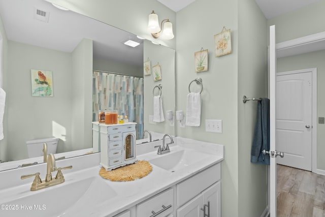 318 N Topsail Dr, Surf City, NC 28445 - bedroom with wood finished floors, baseboards, and ceiling fan
