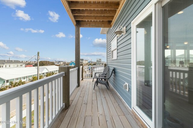 318 N Topsail Dr, Surf City, NC 28445 - kitchen with open floor plan, white cabinetry, appliances with stainless steel finishes, a peninsula, and decorative backsplash