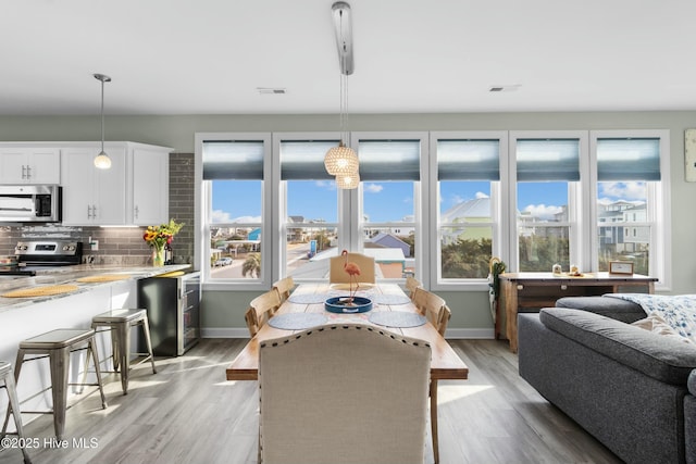318 N Topsail Dr, Surf City, NC 28445 - living area featuring recessed lighting, plenty of natural light, light wood-style flooring, and a ceiling fan