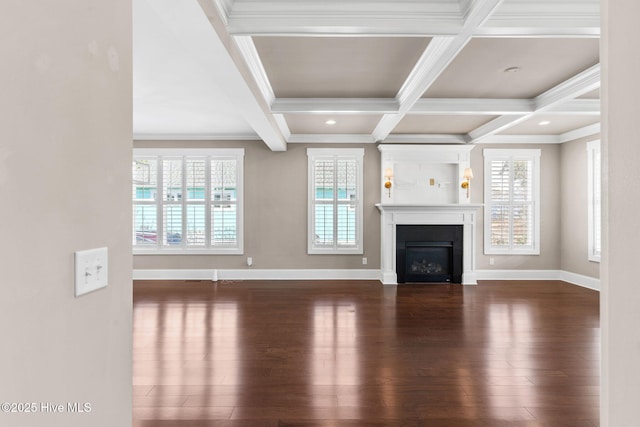 unfurnished living room featuring beam ceiling, coffered ceiling, wood finished floors, and a fireplace