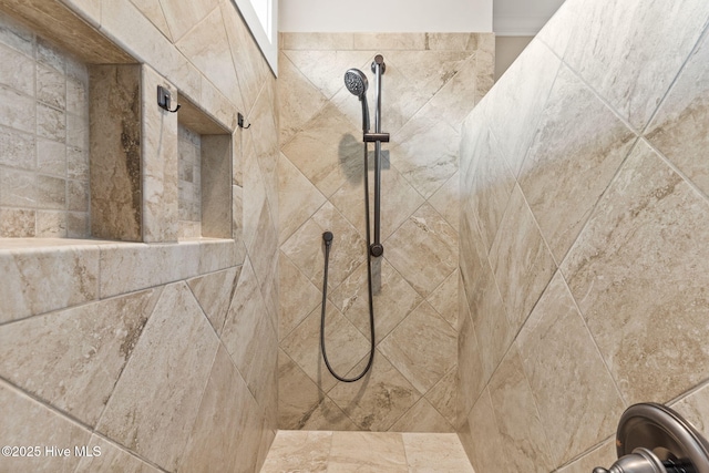 details featuring tiled shower