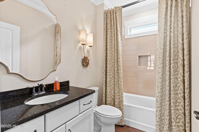 bathroom with vanity, wood finished floors, ornamental molding, shower / bath combo with shower curtain, and toilet