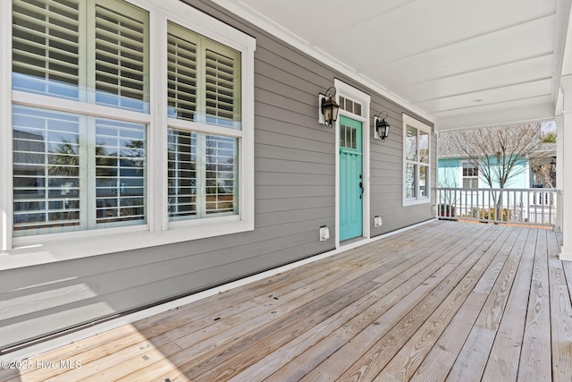 wooden terrace featuring a porch