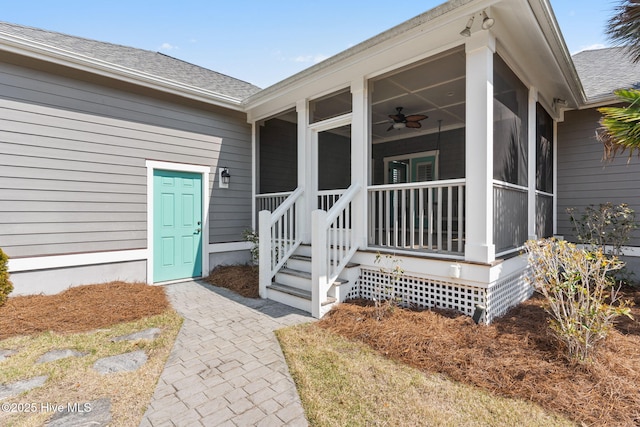 entrance to property featuring a shingled roof