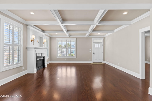 unfurnished living room with beam ceiling, baseboards, dark wood-style flooring, and coffered ceiling