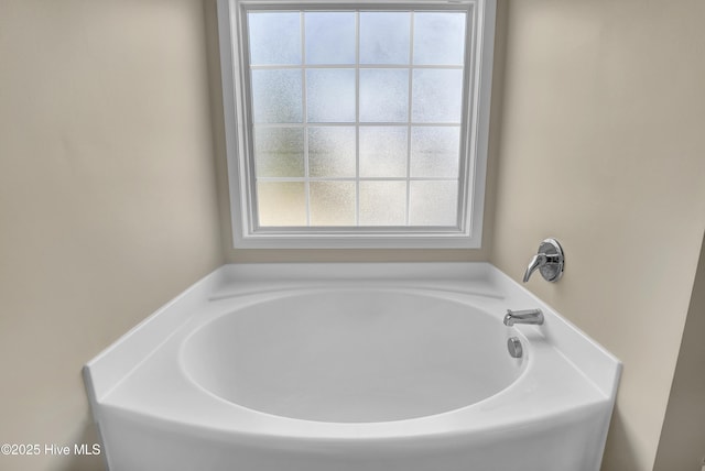 full bathroom with a bath