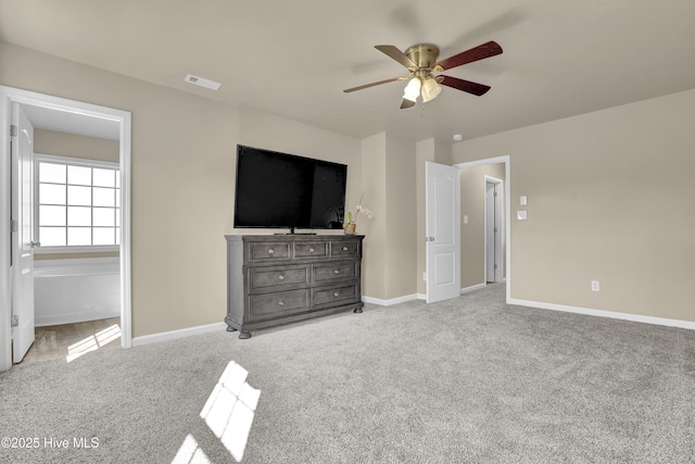 unfurnished bedroom featuring baseboards, carpet, a ceiling fan, and visible vents