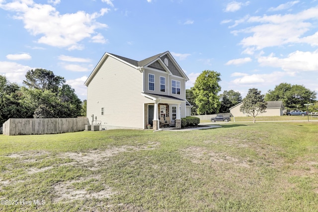 view of side of home with central air condition unit, a patio, a yard, and fence
