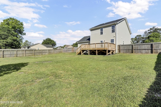 view of yard featuring stairs, a fenced backyard, and a deck