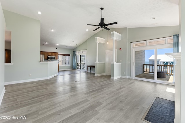 208 Carolina Beach Ave S # 300, Carolina Beach, NC 28428 - unfurnished living room with plenty of natural light, a ceiling fan, high vaulted ceiling, baseboards, and recessed lighting