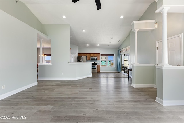 208 Carolina Beach Ave S # 300, Carolina Beach, NC 28428 - unfurnished living room featuring vaulted ceiling, ceiling fan, light wood-type flooring, recessed lighting, and baseboards