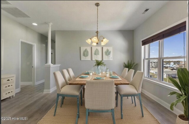 208 Carolina Beach Ave S # 300, Carolina Beach, NC 28428 - dining area featuring wood finished floors, a chandelier, baseboards, and recessed lighting