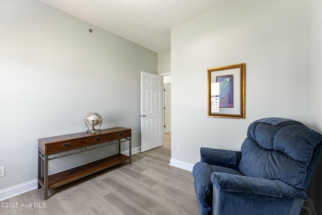 208 Carolina Beach Ave S # 300, Carolina Beach, NC 28428 - living area with light wood-style flooring and baseboards