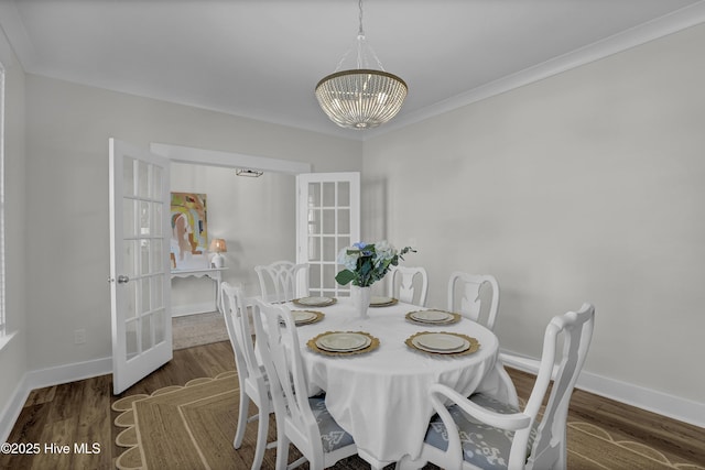 410 Sugar Cv, Wilmington, NC 28411 - dining area featuring a chandelier, french doors, wood finished floors, and crown molding