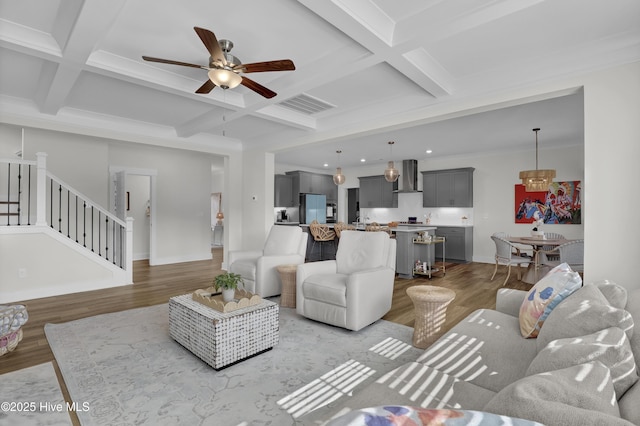 410 Sugar Cv, Wilmington, NC 28411 - living area featuring coffered ceiling, light wood-type flooring, a ceiling fan, beamed ceiling, and stairs