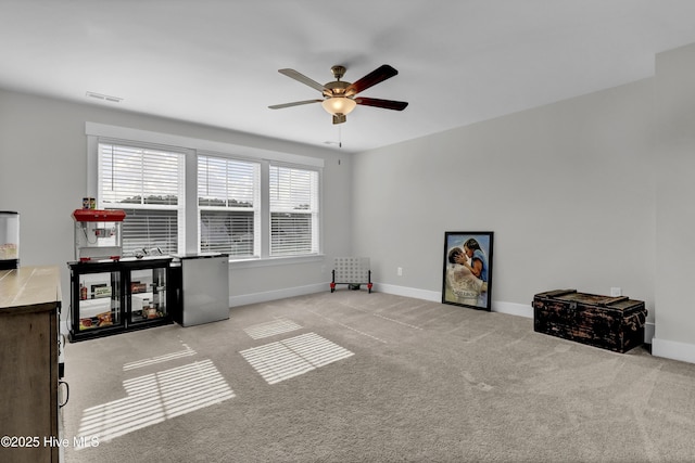 410 Sugar Cv, Wilmington, NC 28411 - carpeted living room with ceiling fan and baseboards