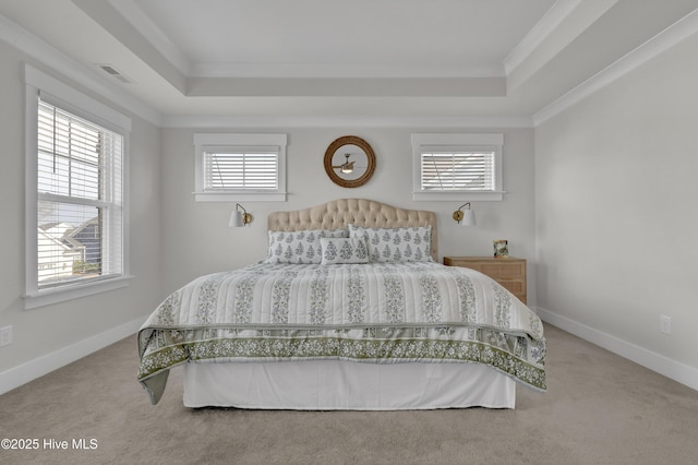 410 Sugar Cv, Wilmington, NC 28411 - carpeted bedroom featuring a tray ceiling and crown molding