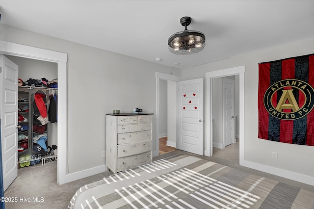 410 Sugar Cv, Wilmington, NC 28411 - carpeted bedroom with a walk in closet and a closet