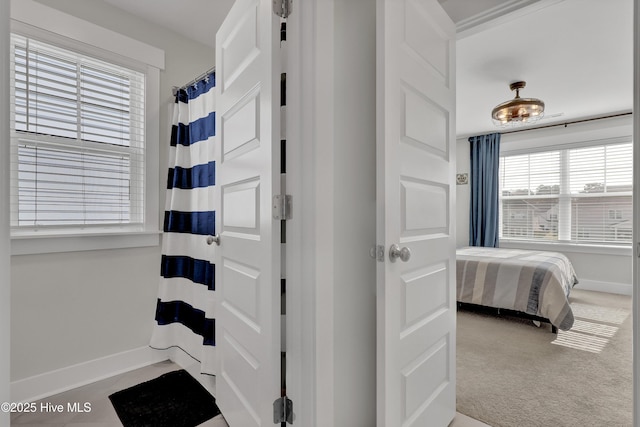 410 Sugar Cv, Wilmington, NC 28411 - ensuite bathroom with baseboards and a shower with shower curtain