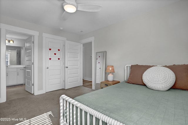 410 Sugar Cv, Wilmington, NC 28411 - carpeted bedroom featuring ensuite bath and ceiling fan