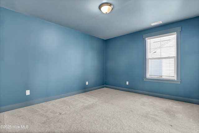 410 Sugar Cv, Wilmington, NC 28411 - carpeted empty room with baseboards