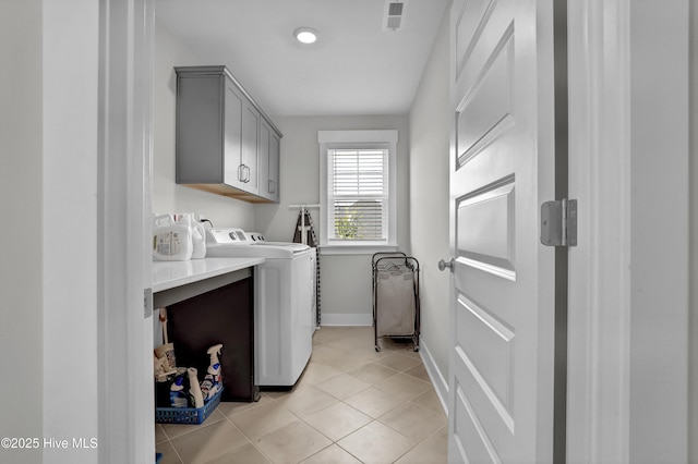 410 Sugar Cv, Wilmington, NC 28411 - laundry area featuring cabinet space, independent washer and dryer, and light tile patterned flooring