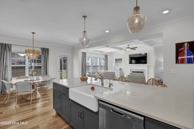 410 Sugar Cv, Wilmington, NC 28411 - kitchen featuring dishwasher, open floor plan, ceiling fan, a fireplace, and light countertops