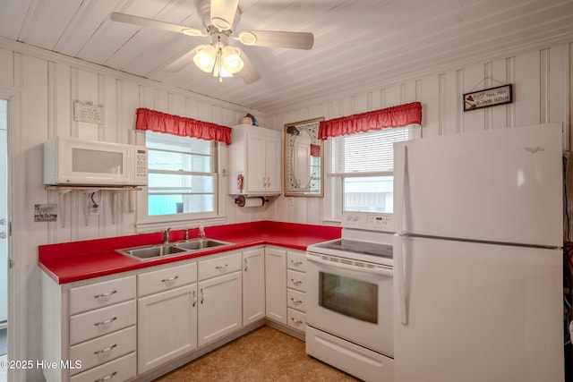 107 Carolina Beach Ave S, Carolina Beach, NC 28428 - kitchen with ceiling fan, white cabinetry, a sink, and white appliances