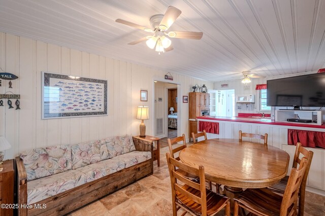 107 Carolina Beach Ave S, Carolina Beach, NC 28428 - dining room featuring visible vents and ceiling fan