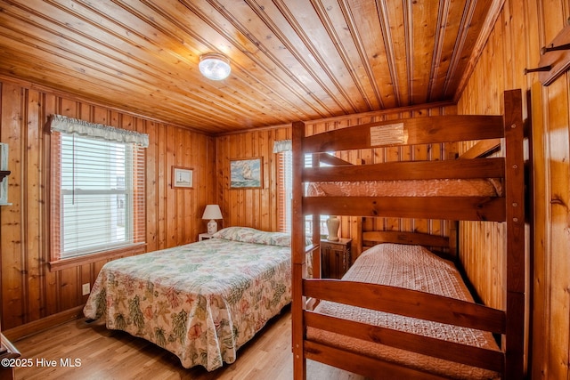 107 Carolina Beach Ave S, Carolina Beach, NC 28428 - bedroom featuring wooden ceiling, wooden walls, and light wood-style flooring