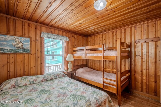107 Carolina Beach Ave S, Carolina Beach, NC 28428 - bedroom with wood finished floors, wood walls, and wooden ceiling