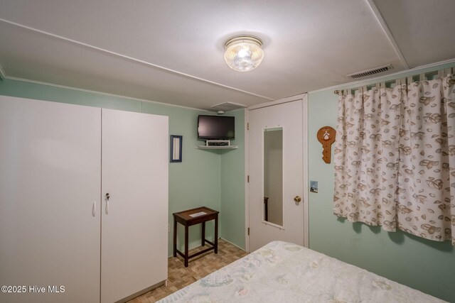 107 Carolina Beach Ave S, Carolina Beach, NC 28428 - bedroom with visible vents and ornamental molding
