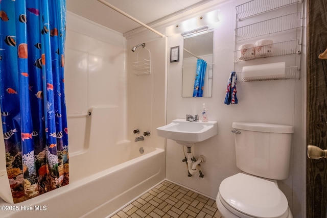 107 Carolina Beach Ave S, Carolina Beach, NC 28428 - full bath featuring shower / tub combo with curtain, brick patterned floor, and toilet