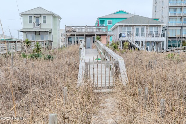 107 Carolina Beach Ave S, Carolina Beach, NC 28428 - view of front of house featuring stairway and a deck