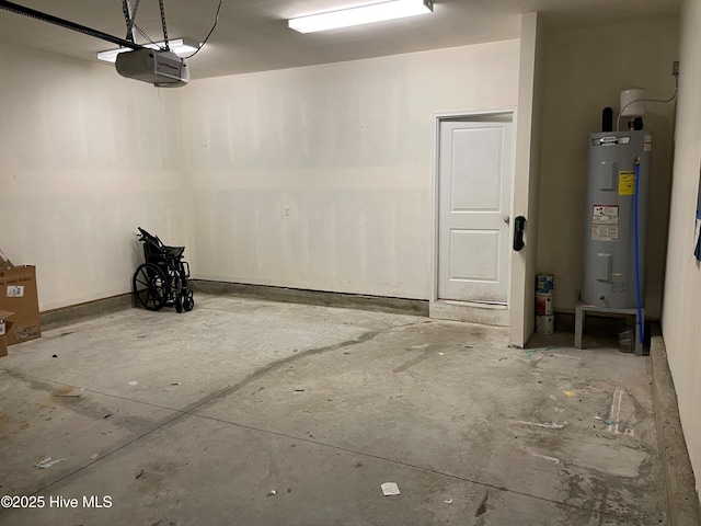 garage with a garage door opener and electric water heater